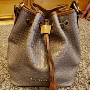 Multiple genuine Dooney and Bourke purses.